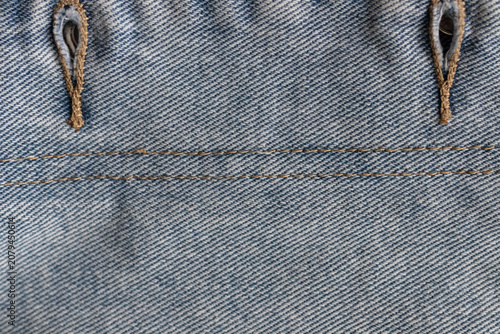 Foto Vertical denim seam and buttonhole detail