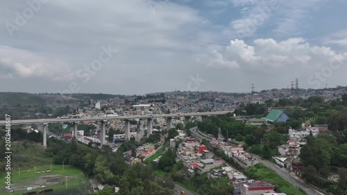 Aerial panoramic view over Panoramic Cityscape and Highway Bridge in Atizapán, Estado de México