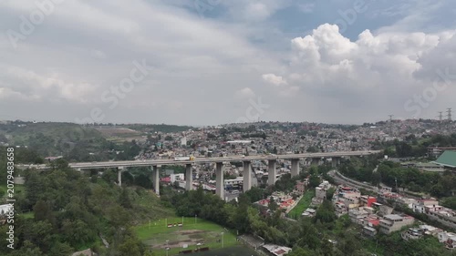 Drone Ascends Vertically Revealing Panoramic Blue Sky View of Atizapán, Estado de México
