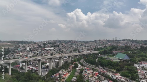 Drone Descends Toward Elevated Highway Overlooking Sprawling Atizapán Cityscape, Estado de México