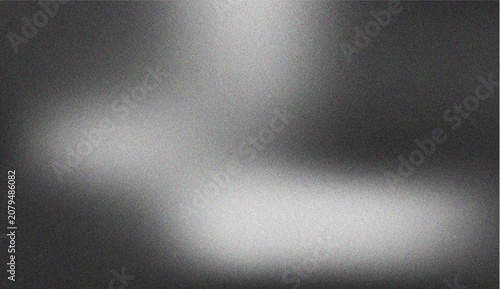 Dramatic Spotlight Effect with Grainy Texture Illuminating a Dark Surface in a Creative Monochromatic Composition