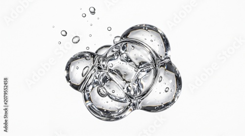 Clear cosmetic gel drop with bubbles isolated on white background