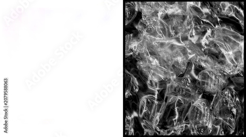 Tableau sur toile Crumpled plastic wrap texture on black background, transparent cellophane film o
