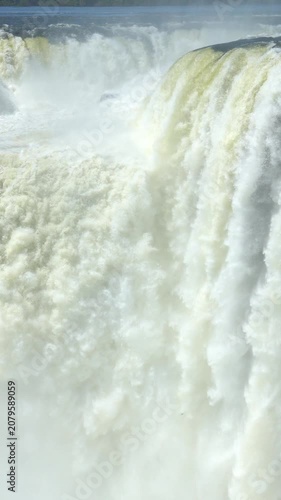 Detailed view of the immense power and beauty of Devil's Throat in iguazu falls. Massive amounts of water cascade over the cliff edge with tremendous force
