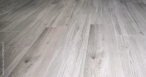 Gray Wood‑Look Tile Plank Flooring with Natural Grain Background Texture