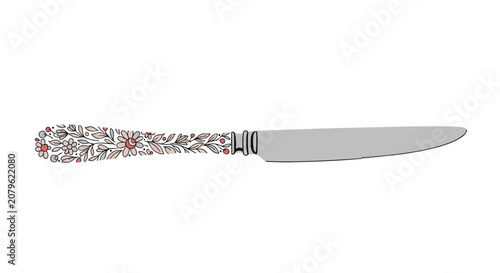 Elegant dinner knife with a beautiful hand drawn floral and leaf pattern on the handle isolated on white.