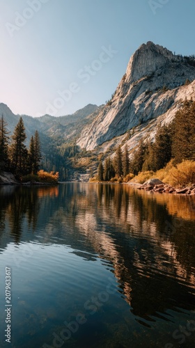 Reflections of a mountain along a serene lake