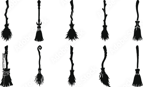 Black broomsticks on white background