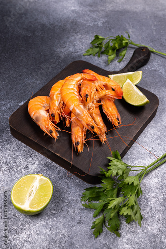 Cooked shrimp with lime and fresh parsley ready for serving