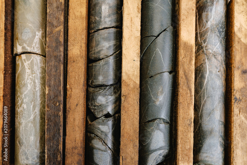 Принти на полотні Geological core samples in wooden crates displaying rock stratification