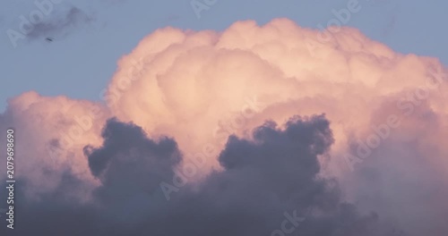 Cumulonimbus clouds during dramatic sunset with fast birds flying before heavy rain and thunderstorm, environment concept video