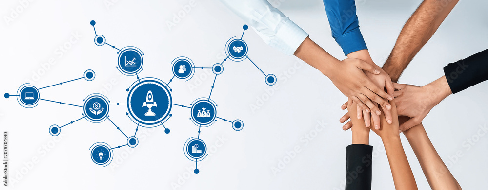 Obraz premium A diverse group of hands coming together symbolizes teamwork and collaboration. The central rocket icon illustrates innovation and growth within a business context. Amity