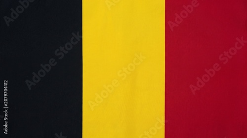 Belgium flag with black, yellow, and red vertical stripes, symbolizing national unity, identity, and cultural heritage rooted in history.