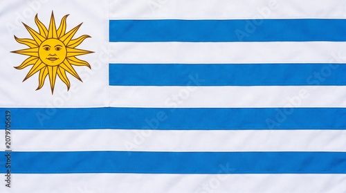 Uruguay flag with blue stripes and Sun of May, symbolizing freedom, independence, and national identity rooted in history and culture.
