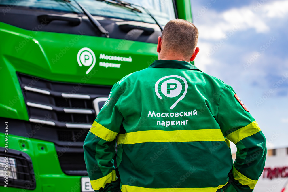 Fototapeta premium Moscow Parking Service employee at a special vehicle on Moscow Street