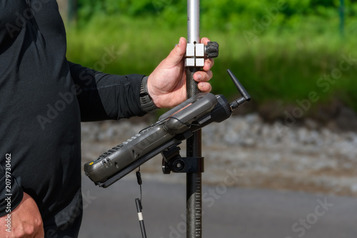 Close up of a land surveyor data controller mounted on a smart pole at a construction site
