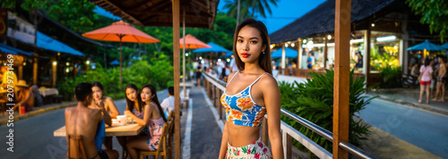 young asian woman in a flor...