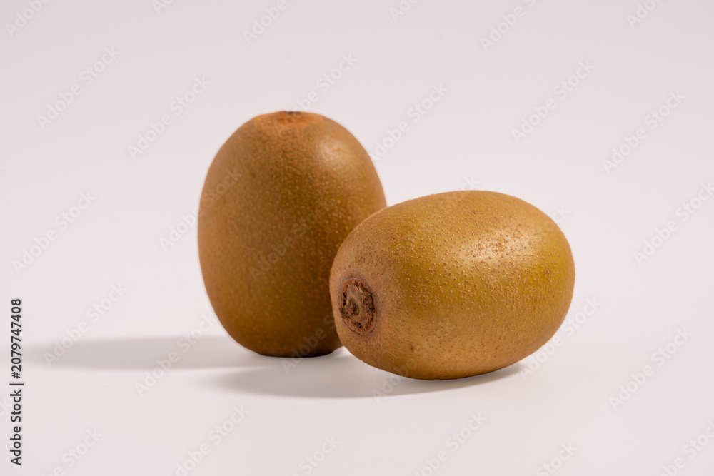 Fototapeta premium Group of kiwi fruits isolated. Two kiwi fruits isolated on white background.