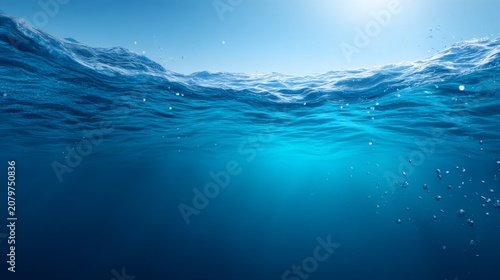 Underwater View of Calm Blue Ocean with Gentle Waves and Sunlight