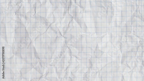Blank sheet of crumpled white graph paper. grunge crumpled white paper texture. wrinkled paper motion