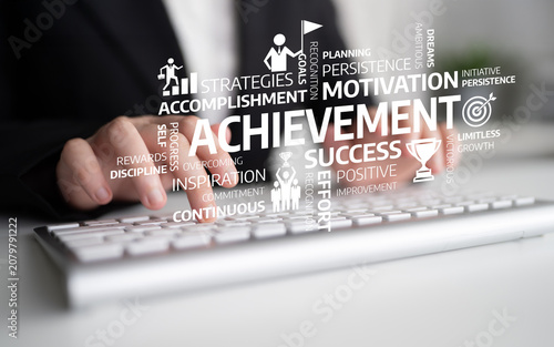 Obraz na plátne A professional typing on a keyboard surrounded by motivational words emphasizing achievement and personal growth, ideal for business and self-improvement themes