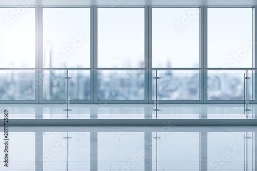 Expansive modern office with panoramic city views and reflective floor