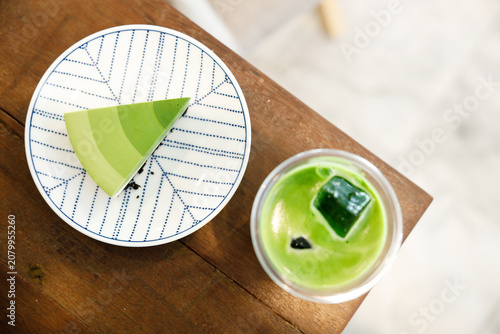Green tea cake pie with gradient layered in cafe.