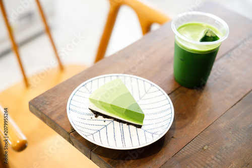 Green tea cake pie with gradient layered in cafe.