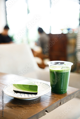 Green tea cake pie with gradient layered in cafe.