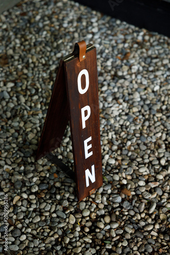 Open sign label outside the shop.