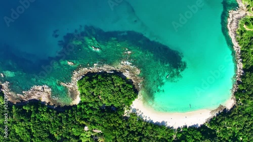 Aerial view Drone camera of seashore rocks in summer season, Beautiful freedom beach in Phuket Thailand, Amazing sea waves crashing on rocks seascape in Phuket island Thailand