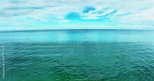 Beautiful Sea in summer season white clouds and blue sky footage from drone