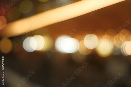 Photography Abstract warm golden bokeh lights background with circular flare