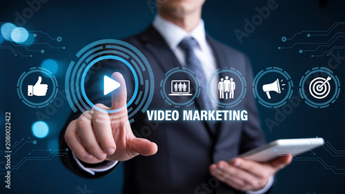 Businessman interacting with digital video marketing interface on tablet