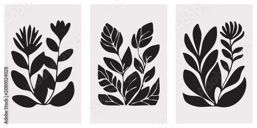 Fotografie Botanical silhouettes of tropical leaves arranged as a triptych on a light beige