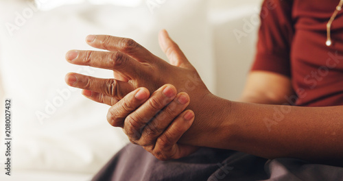 Tableau sur toile Arthritis, hand and massage with person in home living room for joint pain, stiffness or swelling