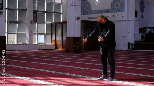The Masked Man Starting to Pray