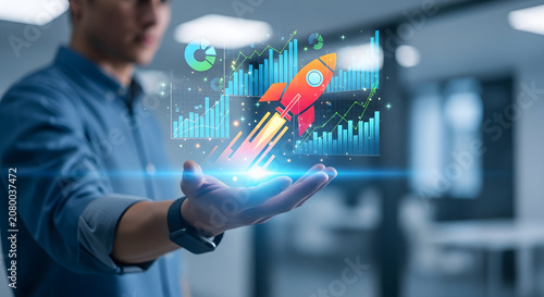 A man in a blue shirt holds a glowing rocket with graphs in his hand.