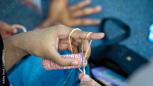 Creating items (lipstick holder) using the craft of knitting. An activity in leisure time.