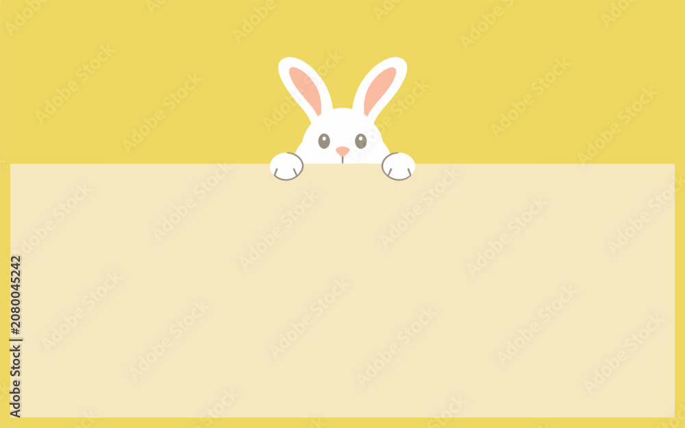 Fototapeta premium A cute white rabbit peeks over a large yellow and beige sign in a playful scene.