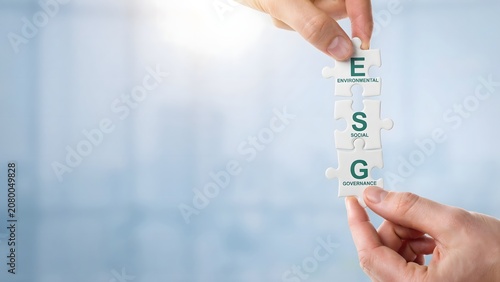 Hands Holding ESG Puzzle Pieces Representing Environmental Social Governance and Sustainable Business Strategy