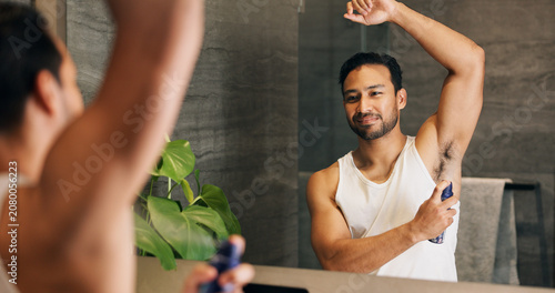 Foto Deodorant, bathroom and man with mirror in home for grooming, hygiene and scent for cleaning