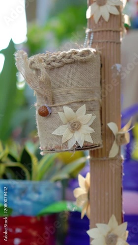 A flower pot made of woven jute rope. Ways to reduce the use of plastic items.