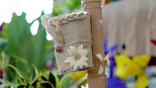 A flower pot made of woven jute rope. Ways to reduce the use of plastic items.