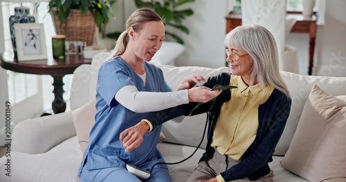 Quadro su tela Doctor, consultation and old woman in home with blood pressure machine, healthcare and assistance