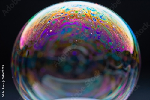 A close up of a soap bubble on a black background_1