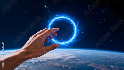 Hand holding glowing blue ring in space