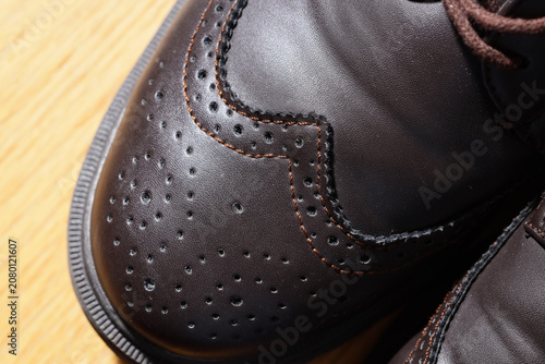 Fotografie close-up of brown leather brogue shoes