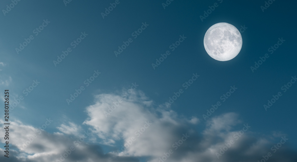 Fototapeta premium Dramatic Dark Sky with Bright Full Moon at Dusk Time