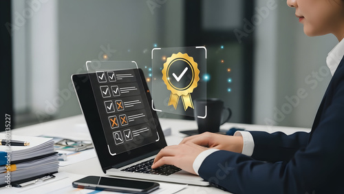 Business person using laptop with quality assurance hologram